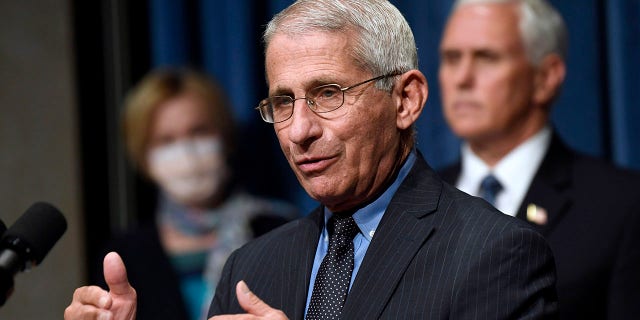 FILE - In this June 26, 2020, file photo Director of the National Institute of Allergy and Infectious Diseases Dr. Anthony Fauci, center, speaks during a news conference with members of the Coronavirus task force at the Department of Health and Human Services in Washington. (AP Photo/Susan Walsh, File)