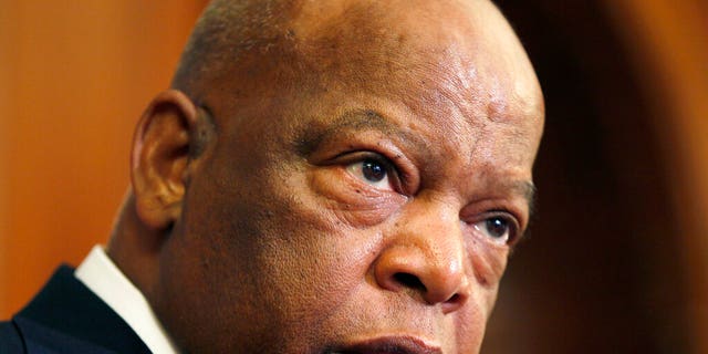 This June 16, 2010 file photo, Rep. John Lewis, D-Ga., participates in a ceremony to unveil two plaques recognizing the contributions of enslaved African Americans in the construction of the United States Capitol on Capitol Hill in Washington. (AP Photo/Carolyn Kaster, File)