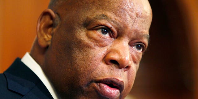 This June 16, 2010 file photo, Rep. John Lewis, D-Ga., participates in a ceremony to unveil two plaques recognizing the contributions of enslaved African Americans in the construction of the United States Capitol on Capitol Hill in Washington. (AP Photo/Carolyn Kaster, File)