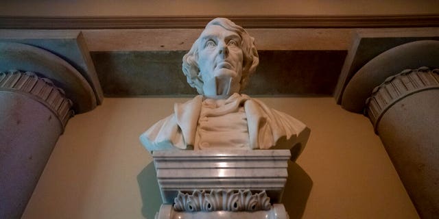 A marble bust of Chief Justice Roger Taney is displayed in the Old Supreme Court Chamber in the U.S. Capitol in Washington. (AP Photo/J. Scott Applewhite, File)