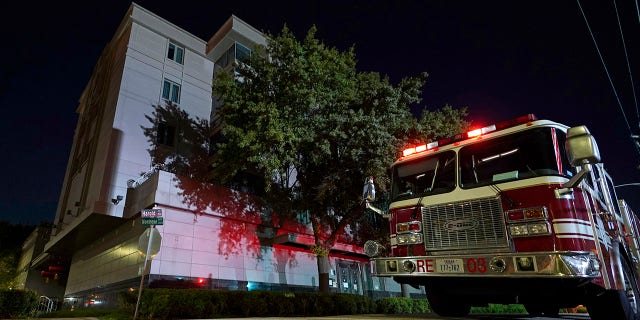 A firetruck is positioned outside the Chinese Consulate Wednesday, July 22, 2020, in Houston. Authorities responded to reports of a fire at the consulate. Witnesses said that people were burning paper in what appeared to be trash cans, according to police. China says the U.S. has ordered it to close its consulate in Houston in what it called a provocation that violates international law. (AP Photo/David J. Phillip)