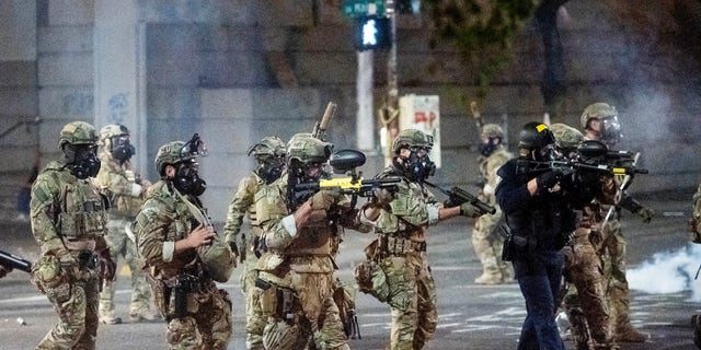 Federal agents use crowd control munitions to disperse Black Lives Matter protesters at the Mark O. Hatfield United States Courthouse in Portland, Ore. on July 20, 2020. (Associated Press)