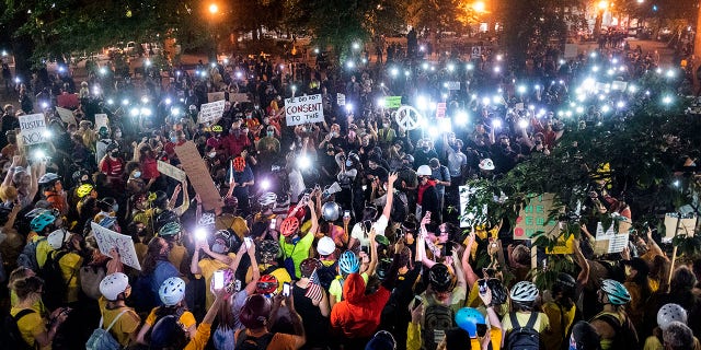 Hundreds of Black Lives Matter protesters rally near the Mark O. Hatfield United States Courthouse on Tuesday, July 21, 2020, in Portland, Ore. (AP Photo/Noah Berger)