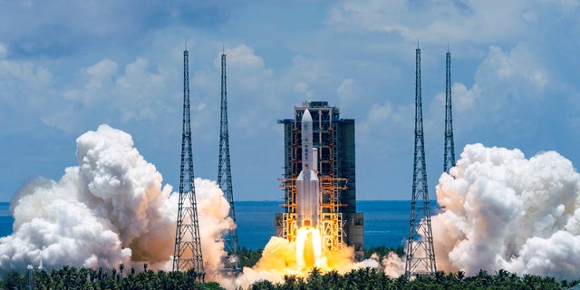 A Long March-5 rocket carrying the Tianwen-1 Mars probe lifts off from the Wenchang Space Launch Center in southern China's Hainan Province, Thursday, July 23, 2020. China launched its most ambitious Mars mission yet on Thursday in a bold attempt to join the United States in successfully landing a spacecraft on the red planet. (Cai Yang/Xinhua via AP)