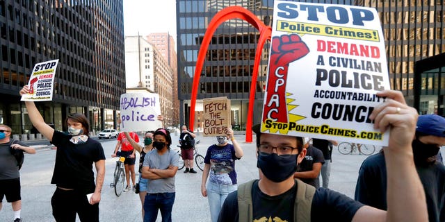 Protesters gather on Federal Plaza after a collection of Chicago activists groups announced they are filing a federal lawsuit against the Chicago Police Department, Fraternal Order of Police, and the federal government, in Chicago. 