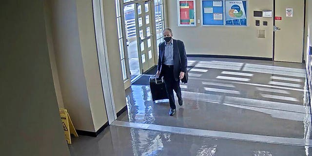 This July 11, 2020 surveillance photo provided by the San Bernardino County Sheriff's Department shows who is believed to be Roy Den Hollander, passing through Union Station in Los Angeles. (Courtesy of San Bernardino County Sheriff's Department via AP)
