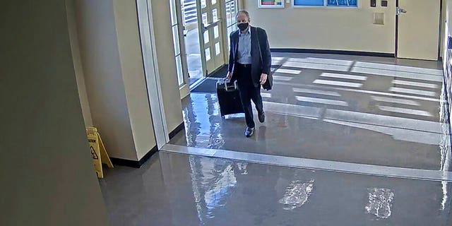 This July 11, 2020 surveillance photo provided by the San Bernardino County Sheriff's Department shows who is believed to be Roy Den Hollander, passing through Union Station in Los Angeles. (Courtesy of San Bernardino County Sheriff's Department via AP)