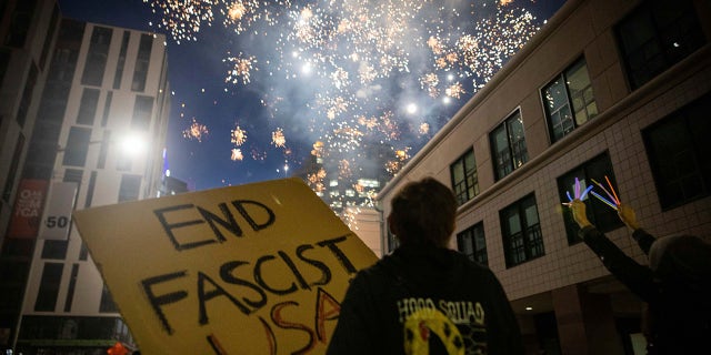 Protesters light fireworks in the middle of downtown Oakland during a protest on Saturday, July 25, 2020, in Oakland, Calif. (Associated Press)