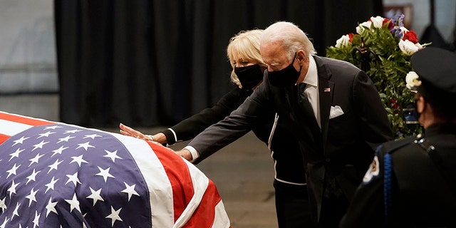 Then-Democratic presidential candidate Joe Biden and wife Jill Biden touch the flag-draped casket of the late Rep. John Lewis, D-Ga., at the Capitol in Washington, July 27, 2020. (Associated Press)