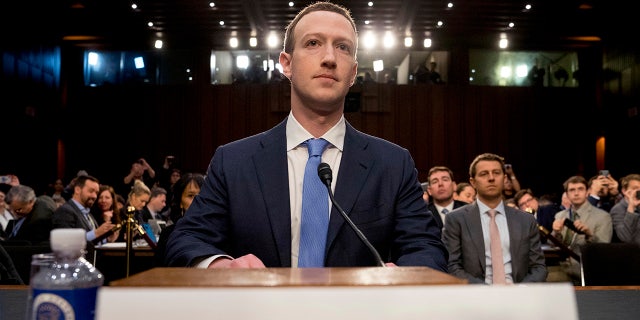 In this April 10, 2018 photo, Facebook CEO Mark Zuckerberg arrives to testify before a joint hearing of the Commerce and Judiciary Committees on Capitol Hill in Washington. (AP Photo/Andrew Harnik)