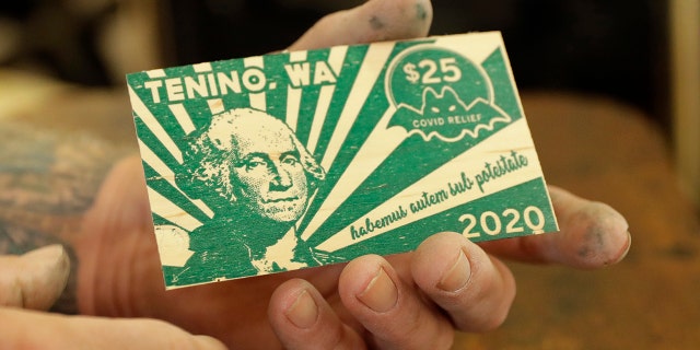 election 2020 Donald Trump President Trump Conservative News RNC In an effort to help residents and local merchants alike get through the economic fallout of the coronavirus pandemic, the small town has issued wooden currency for residents to spend at local businesses, decades after it created a similar program during the Great Depression. (AP Photo/Ted S. Warren)