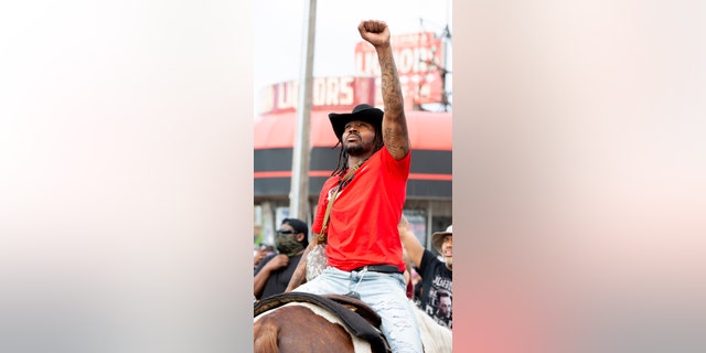 MINNEAPOLIS, USA - MAY 27: Adam Hollingsworth sits on his horse Prince on Wednesday, May 27, 2020, during the second day of protests over the death of George Floyd in Minneapolis. (Photo by Steel Brooks/Anadolu Agency via Getty Images)