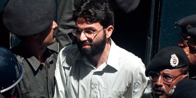 Ahmed Omar Saeed Sheikh, the alleged mastermind behind Wall Street Journal reporter Daniel Pearl's abduction, arrives March 29, 2002 at the provincial high court in Karachi, Pakistan. (Photo by Getty Images)