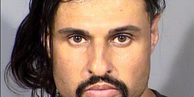 Ash Armand is accused of beating a female victim to death in Las Vegas, Nev.