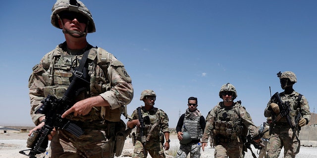 U.S. troops patrol at an Afghan National Army (ANA) Base in Logar province, Afghanistan August 7, 2018. REUTERS/Omar Sobhani - RC11956A58A0