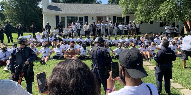 Over 100 demonstrators marched from a local high school in Louisville to the attorney general’s home to demand he charge the three officers involved in Taylor’s death.