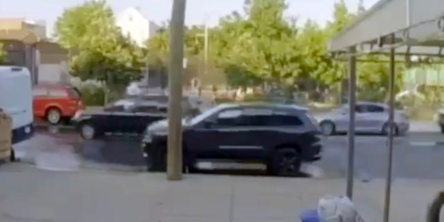 A black SUV, left of center, is being sought by police following the shooting of the teens. (NYPD)