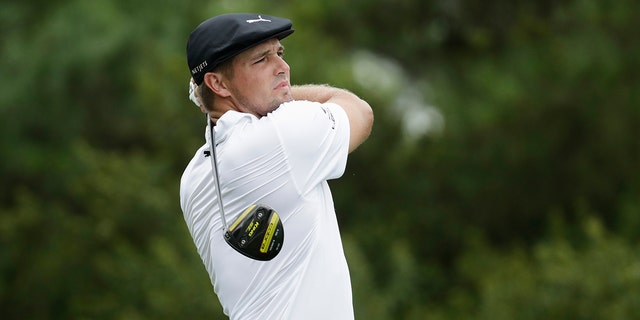 Bryson DeChambeau watches his tee shot on the 17th hole during the first round of the World Golf Championship-FedEx St. Jude Invitational Thursday, July 30, 2020, in Memphis, Tenn. (AP Photo/Mark Humphrey)