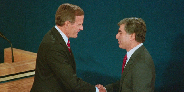 Presidential candidate Vice President George H.W. Bush and Massachusetts Gov. Michael Dukakis shake hands before the start of their debate at Wake Forest University in Winston-Salem, N.C.