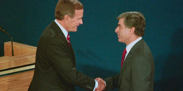 Presidential candidate Vice President George H.W. Bush and Massachusetts Gov. Michael Dukakis shake hands before the start of their debate at Wake Forest University in Winston-Salem, N.C.