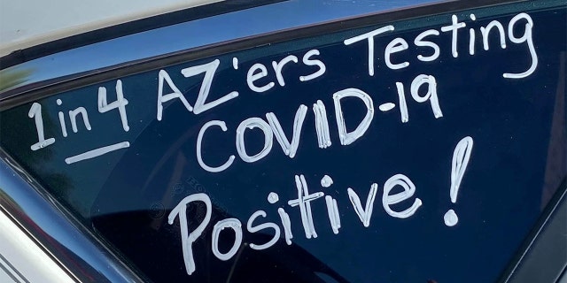 A slogan is seen on a car in "a motor march” protest of teachers who took it to their vehicles to demand a delay in in-person learning in the fall, due to the coronavirus disease (COVID-19) outbreak, in Phoenix, Arizona, U.S., July 15, 2020. Picture taken July 15, 2020. REUTERS/Kelley Fisher NO RESALES. NO ARCHIVES - RC2NVH9P22JL