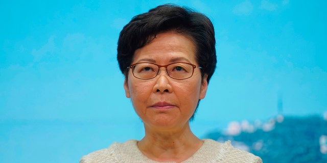 Hong Kong Chief Executive Carrie Lam listens to reporters' questions during a press conference in Hong Kong, Tuesday, July 7, 2020. TikTok said Tuesday it will stop operations in Hong Kong, joining other social media companies in warily eyeing ramifications of a sweeping national security law that took effect last week. (AP Photo/Vincent Yu)