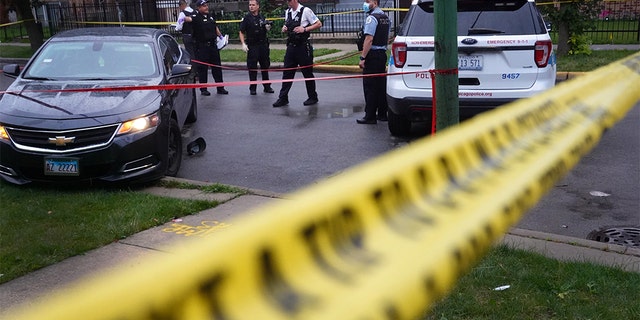 Police investigate the scene of a shooting in the Auburn Gresham neighborhood on July 21, 2020, in Chicago. (Scott Olson/Getty Images, File)