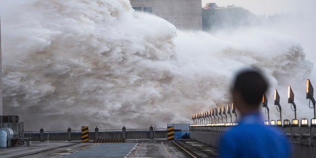 In this photo released by Xinhua News Agency, floodwaters are discharged at the Three Gorges Dam in central China's Hubei province on July 19.
