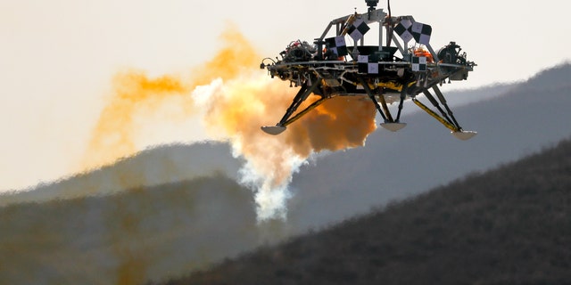 In this Thursday, Nov. 14, 2019 file photo, the Mars lander's hovering, obstacle avoidance and deceleration capabilities are tested at a facility at Huailai in China's Hebei province.