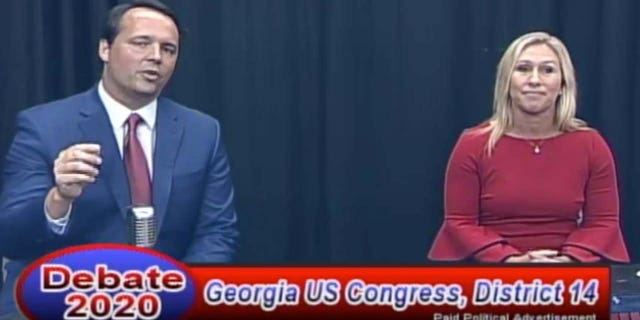 Marjorie Greene (R) and John Cowan (R) debate Wednesday for the 14th Congressional district seat in Georgia.