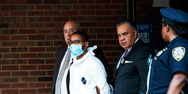 Tyrese Haspil, 21, is escorted out of the 7th precinct by NYPD detectives, Friday, July 17, 2020, in New York. Haspil faces a murder charge in the death of Fahim Saleh, 33-year-old tech entrepreneur who was found dismembered inside his luxury Manhattan condo.