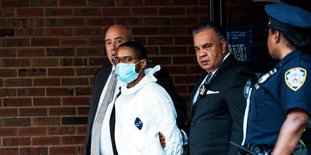 Tyrese Haspil, 21, is escorted out of the 7th precinct by NYPD detectives, Friday, July 17, 2020, in New York. Haspil faces a murder charge in the death of Fahim Saleh, 33-year-old tech entrepreneur who was found dismembered inside his luxury Manhattan condo.