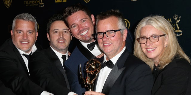 Producers Jonathan Norman, Andy Lassner, Kevin Leman, Ed Glavin and Mary Connelly pose with the award for Outstanding Talk Show Entertainment for "The Ellen DeGeneres Show" in the press room during The 42nd Annual Daytime Emmy Awards at Warner Bros. Studios on April 26, 2015 in Burbank, Calif.