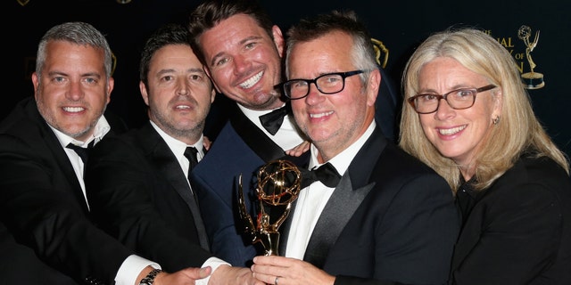 Producers Jonathan Norman, Andy Lassner, Kevin Leman, Ed Glavin and Mary Connelly pose with the award for Outstanding Talk Show Entertainment for "The Ellen DeGeneres Show" in the press room during The 42nd Annual Daytime Emmy Awards at Warner Bros. Studios on April 26, 2015 in Burbank, Calif.