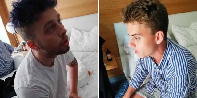 In this combo photo released by Italian Carabinieri, Gabriel Christian Natale Hjorth, right, and Finnegan Lee Elder, sit in their hotel room in Rome. (Italian Carabinieri via AP)