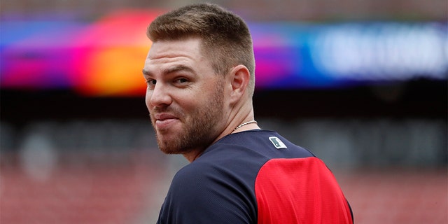 Atlanta Braves' Freddie Freeman looks over his shoulder as he enters the batting cage during a baseball workout in St. Louis, Oct. 5, 2019. (Associated Press)