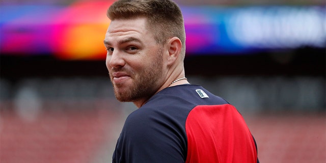 Atlanta Braves' Freddie Freeman looks over his shoulder as he enters the batting cage during a baseball workout in St. Louis, Oct. 5, 2019. (Associated Press)