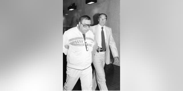 Queens, New York: Angelo Ruggiero, a member of organized crime .is under arrest at FBI offices on Queens Blvd. in Rego Park, N.Y. on June 20, 1986.