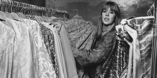 Jenny Boyd, sister-in-law of Beatle George Harrison, helps out at Apple, the Beatles clothes boutique in Baker Street, London, circa 1967.
