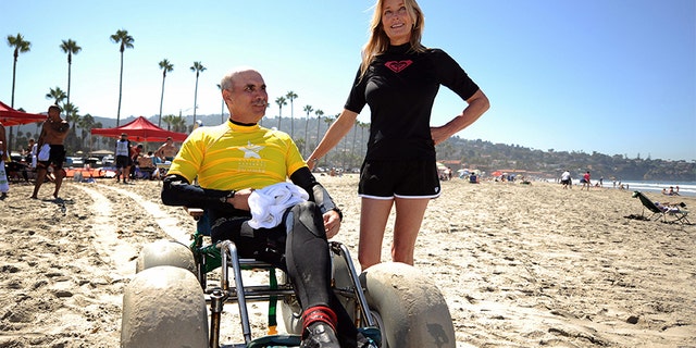 US Army Veteran Joseph Smith (L) chats with US actress Bo Derek after a surfing lesson during the 2nd National Veterans Summer Sports Clinic in San Diego, California on September 25, 2009. The National Veterans Summer Sports Clinic introduces recently injured Veterans to adventure sports and recreational activities such as surfing, sailing, cycling, or kayaking. During one week, organized by the US Department of Veterans Affairs, they promote rehabilitation of body and spirit. US actress Bo Derek is supporting the program as a volunteer.