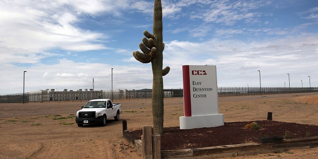 A cactus and sign mark the entrance to the Eloy Detention Facility for illegal immigrants on July 30, 2010 in Eloy, Arizona. (Photo by John Moore/Getty Images)