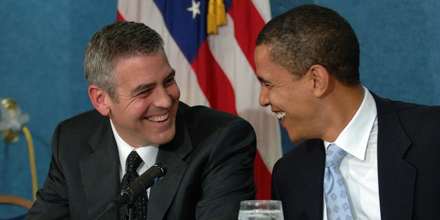 Actor George Clooney (L) and Senator Barack Obama (D - Illinois) during a press conference in Washington DC, where Clooney spoke about his recent visit to the Darfur region of Sudan, on April 27, 2006. (Photo by ImageCatcher News Service/Corbis via Getty Images)