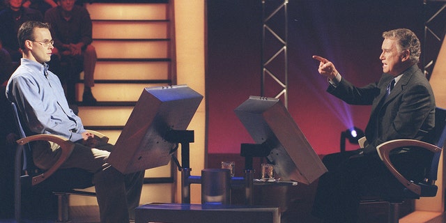 Regis Philbin with John Carpenter, the first $1 million winner on 