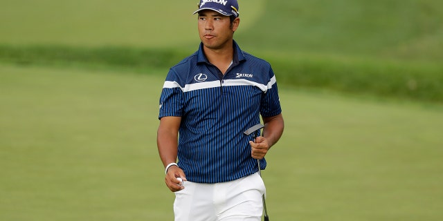 Hideki Matsuyama walks on the 13th green during the first round of the Memorial golf tournament, Thursday, July 16, 2020, in Dublin, Ohio. (AP Photo/Darron Cummings)
