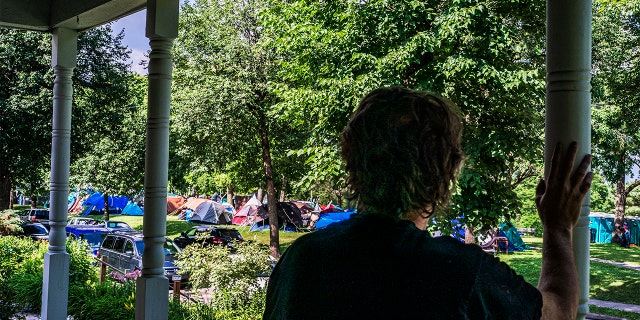 Peter Gross, who has lived in his house across the street from Powderhorn Park in Minneapolis since 1993, sees homelessness as part of a larger problem. (Photo by Richard Tsong-Taatarii/Star Tribune via Getty Images)