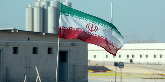 A picture taken on November 10, 2019, shows an Iranian flag in Iran's Bushehr nuclear power plant, during an official ceremony to kick-start works on a second reactor at the facility. - Bushehr is Iran's only nuclear power station and is currently running on imported fuel from Russia that is closely monitored by the UN's International Atomic Energy Agency. (Photo by ATTA KENARE / AFP) (Photo by ATTA KENARE/AFP via Getty Images)