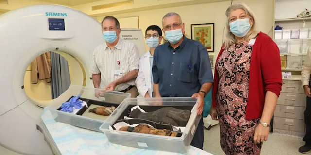 Examining the two Egyptian mummies at Rambam Health Care Campus.