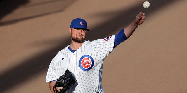 Chicago Cubs pitcher Jon Lester warms up before an intrasquad baseball game at Wrigley Field in Chicago, Friday, July 17, 2020. (AP Photo/Nam Y. Huh)
