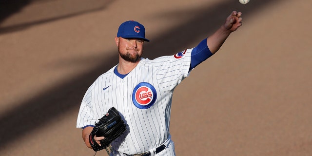 Chicago Cubs pitcher Jon Lester warms up before an intrasquad baseball game at Wrigley Field in Chicago, Friday, July 17, 2020. (AP Photo/Nam Y. Huh)