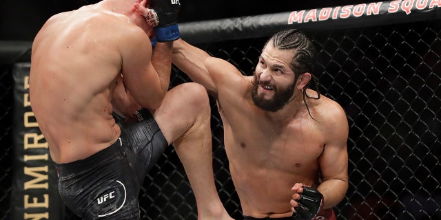 FILE - In this Nov. 3, 2019, file photo, Jorge Masvidal, right, punches Nate Diaz during the second round of a welterweight mixed martial arts bout at UFC 244 in New York.